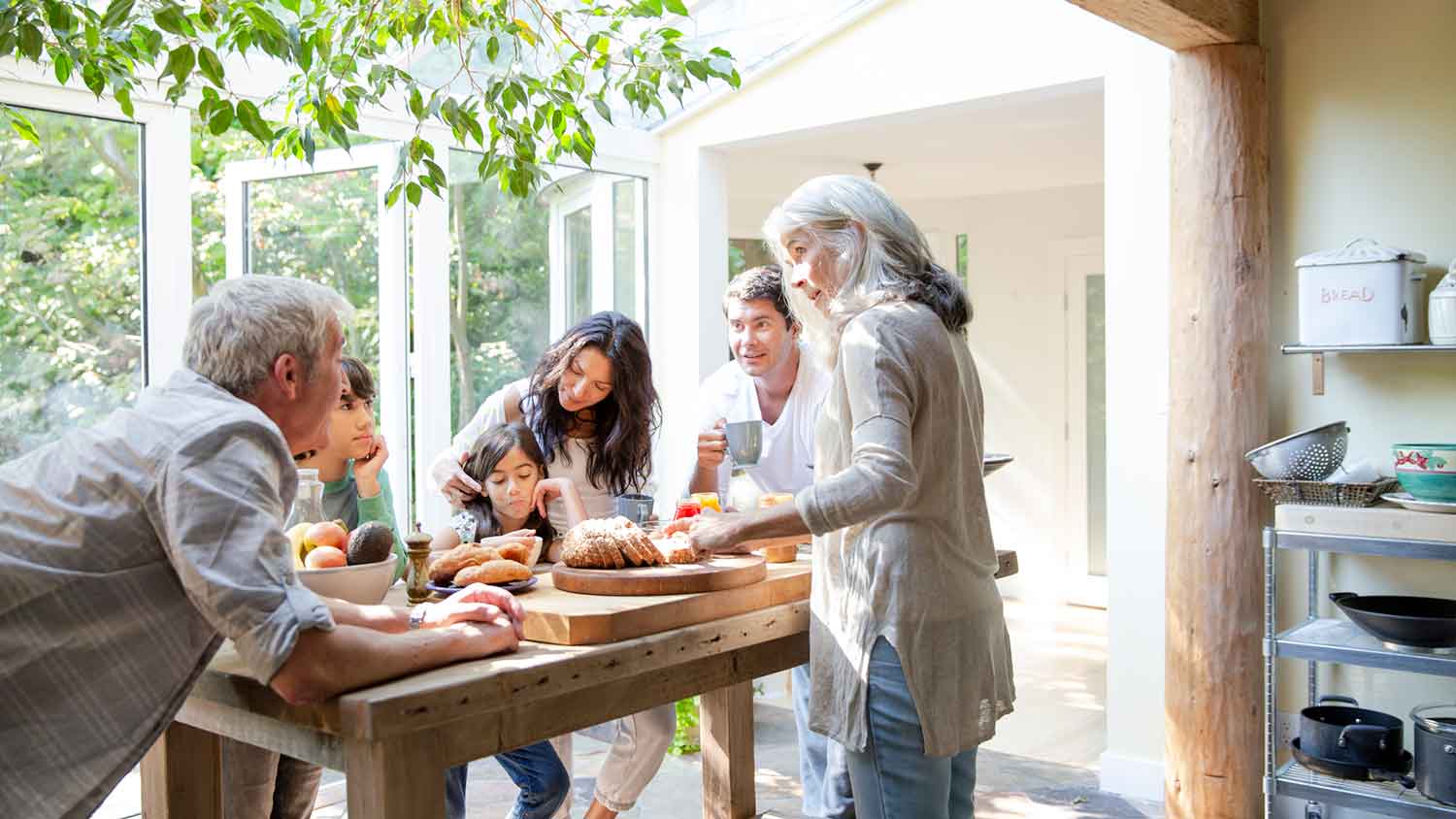 Family having breakfast in the sunroom kitchen