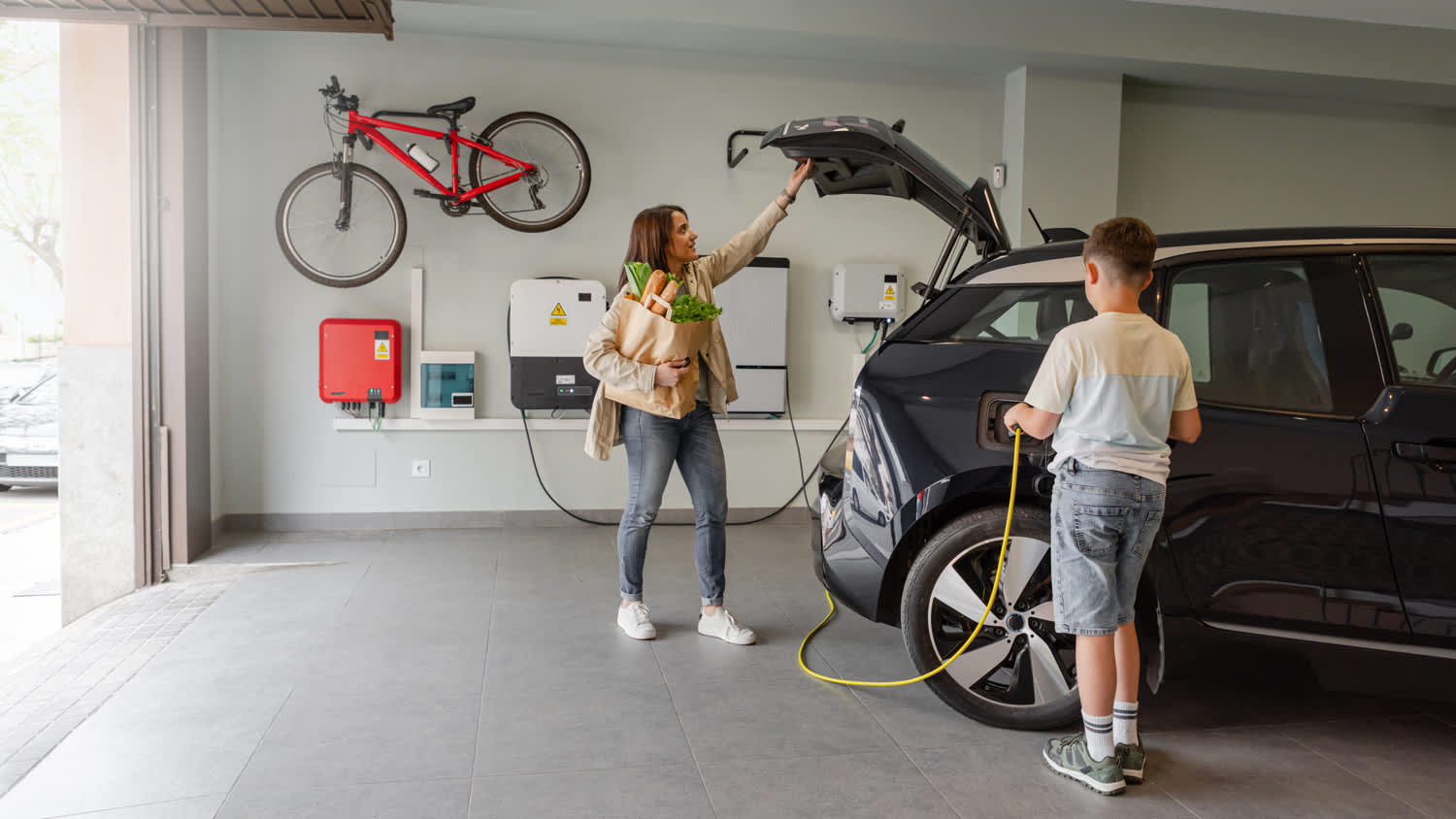 Family unpacking car in Garage
