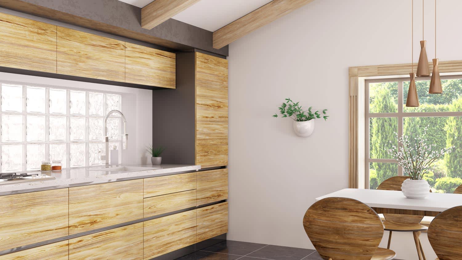The interior of a modern kitchen with glass block windows and wooden cabinets