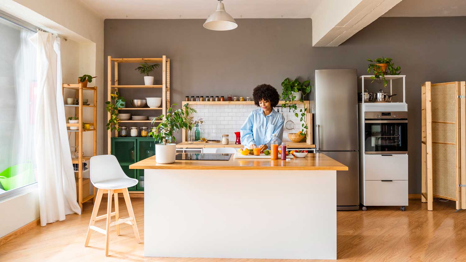 A woman preparing breakfast on a kitchen island