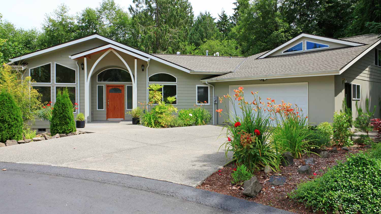 Beautiful clean beige house and driveway
