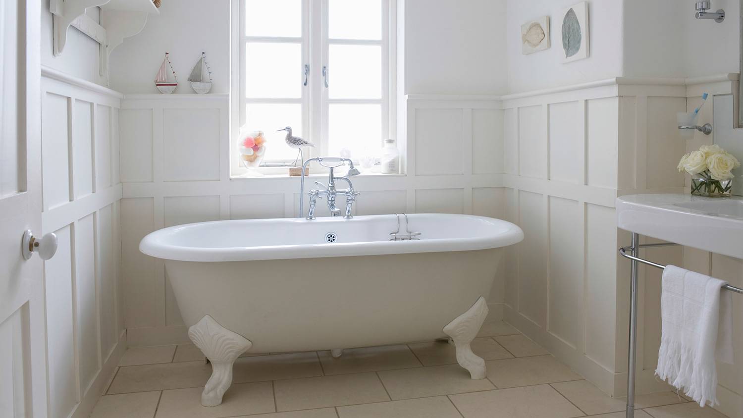 Bathroom with wainscoting around lower walls