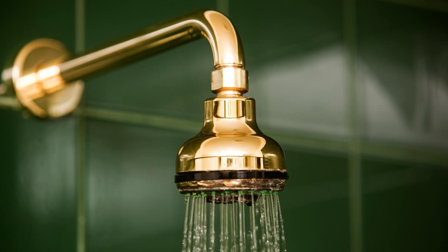 A shower head running water