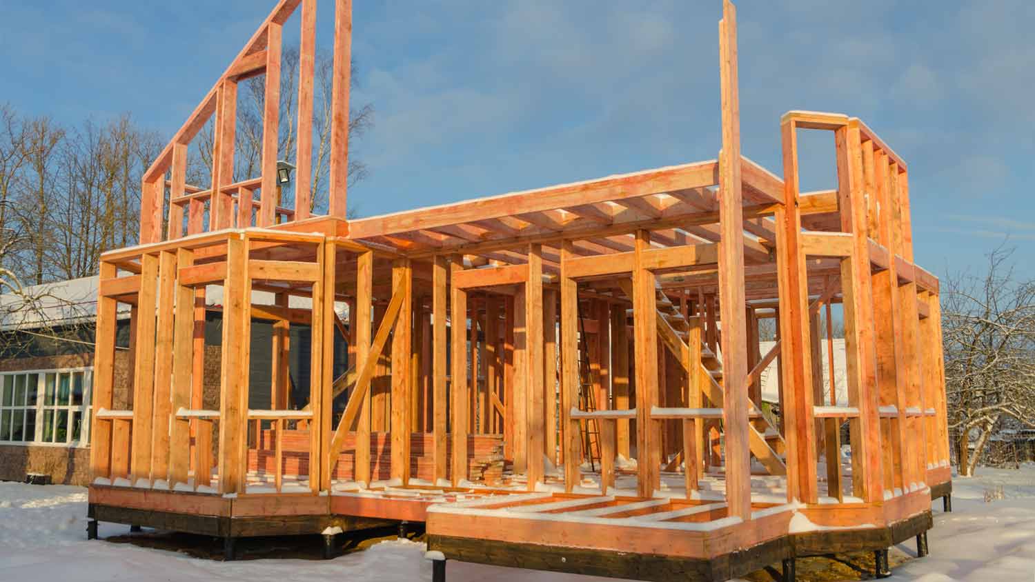 frame wooden house foundation in the winter