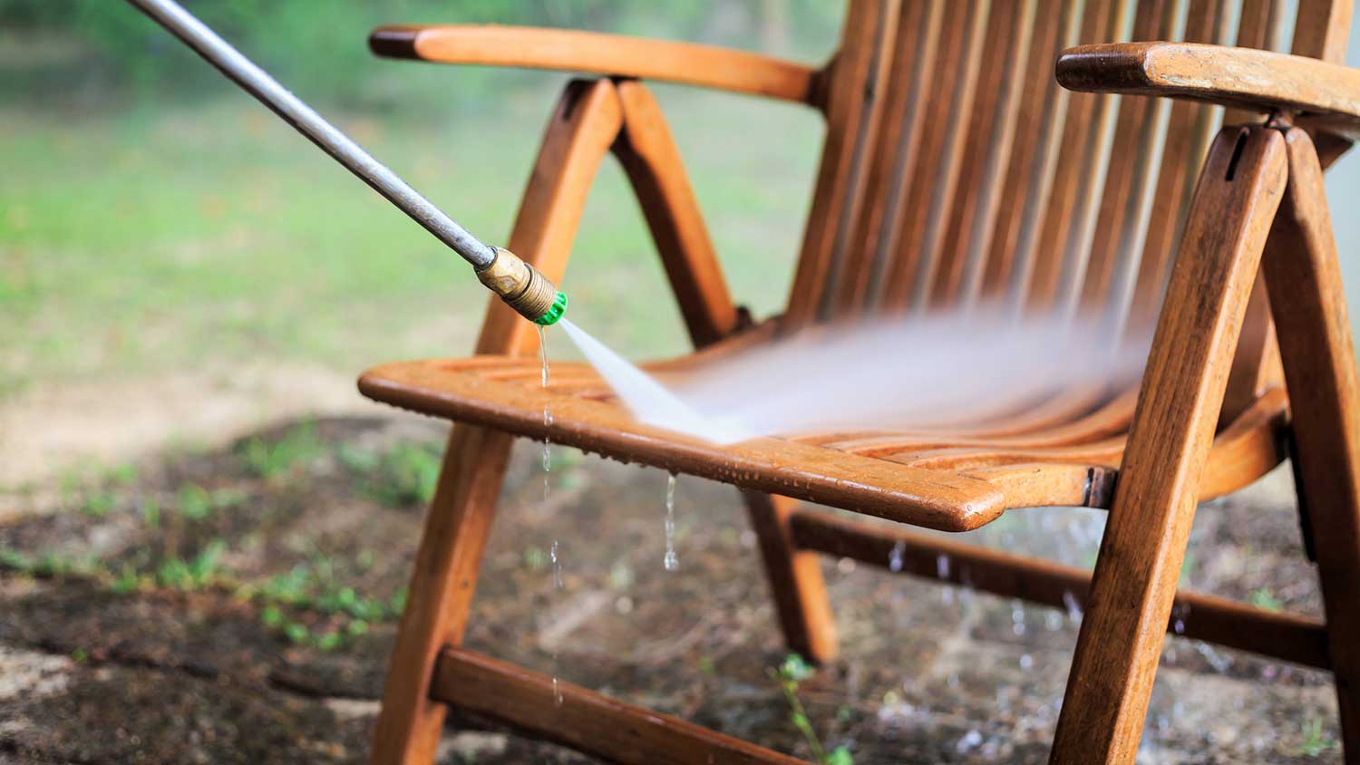 Using pressure washer to clean outdoor furniture