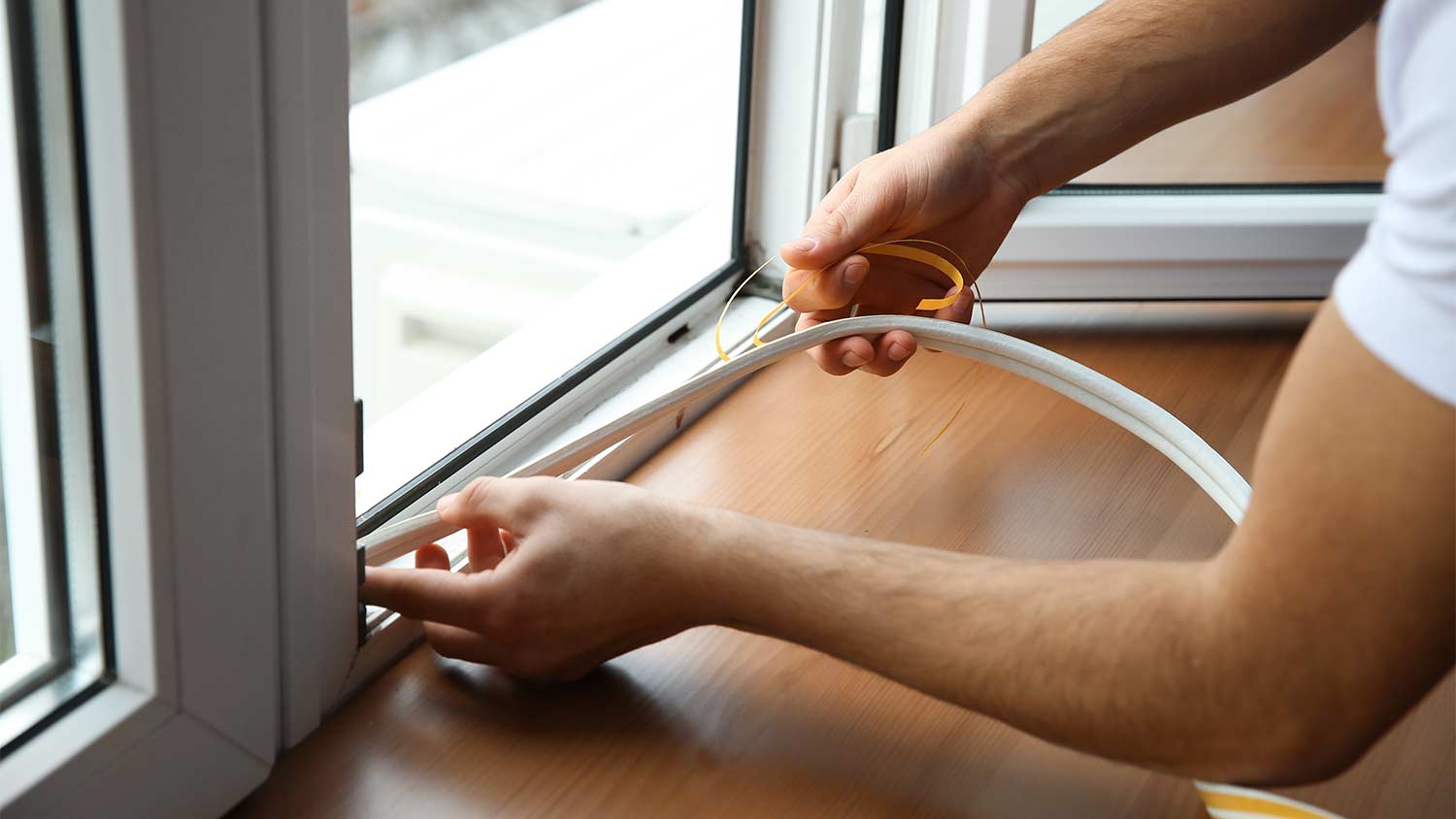professional installing window seal