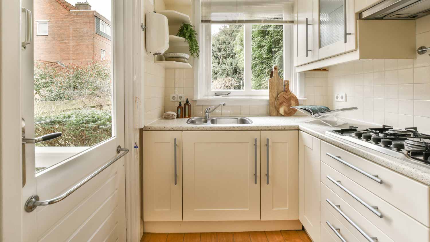 kitchen with wooden floor and white cabinets