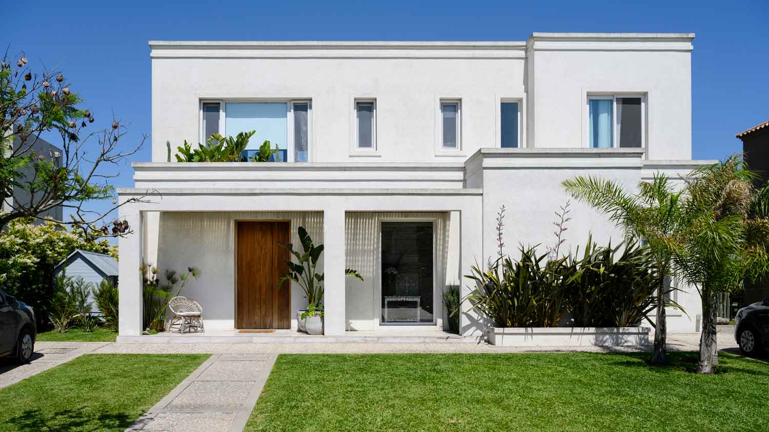 A contemporary two-story house on a sunny day