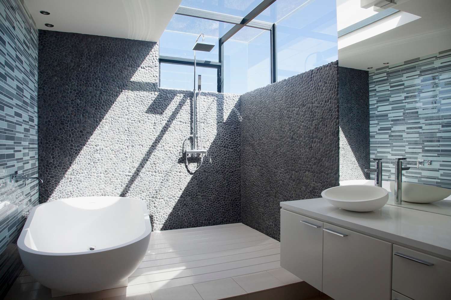 Stone and glass curbless luxury shower
