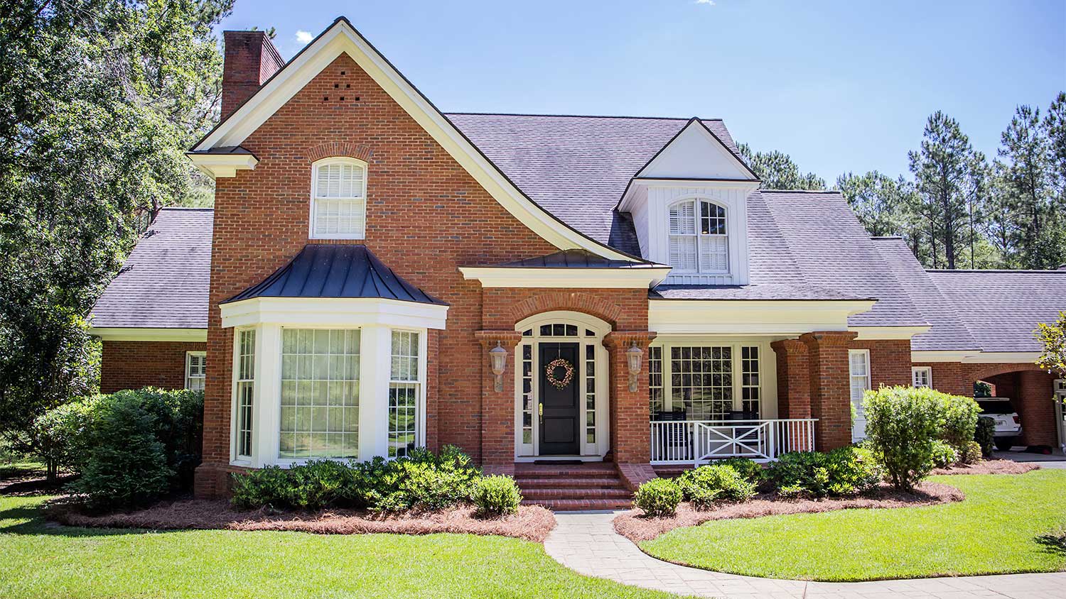 Exterior of a traditional colonial red brick house