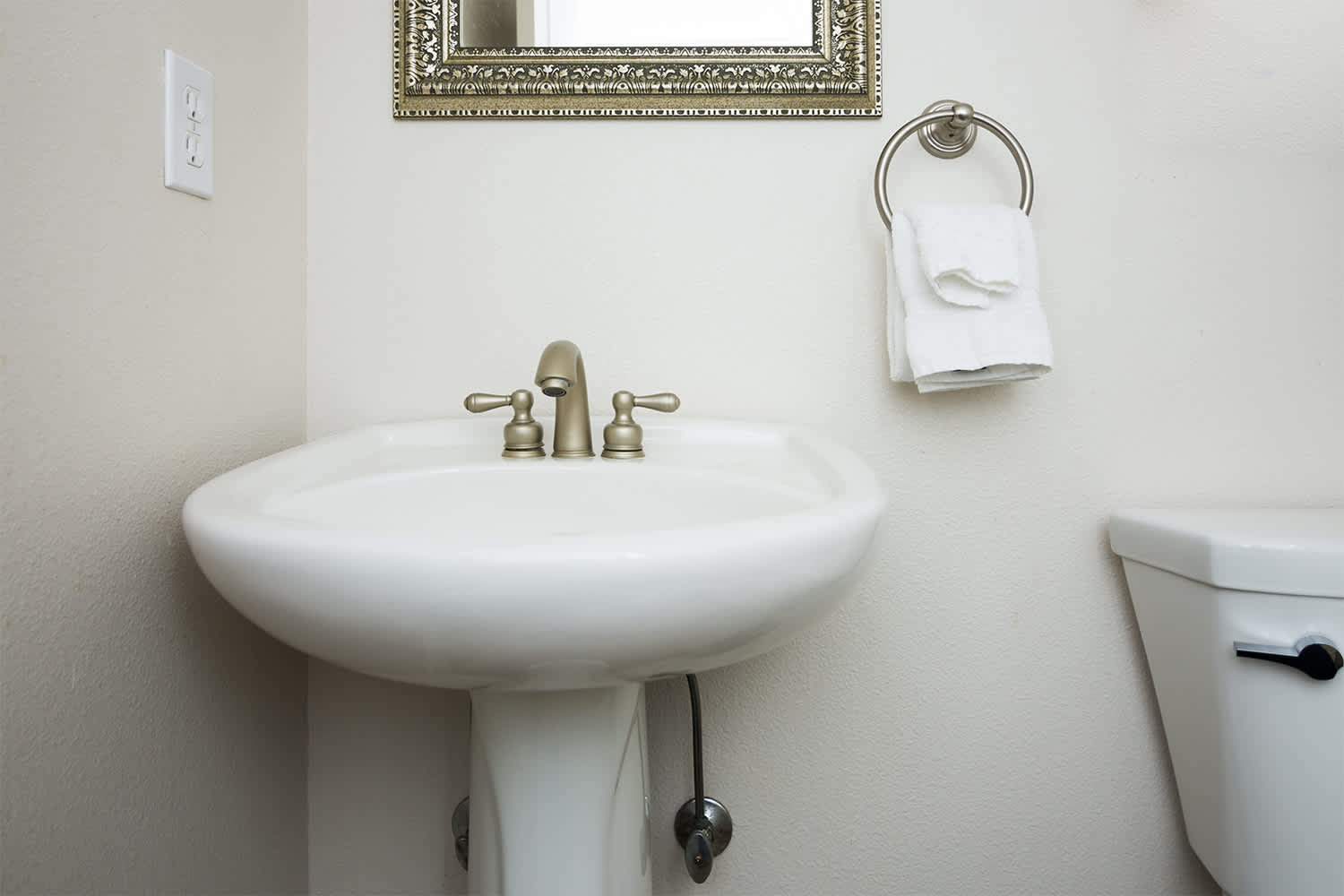 Bathroom with white pedestal sink