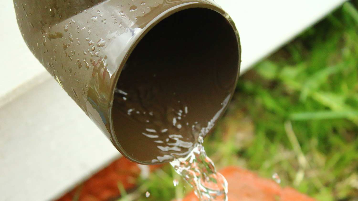 A plastic drain with running water
