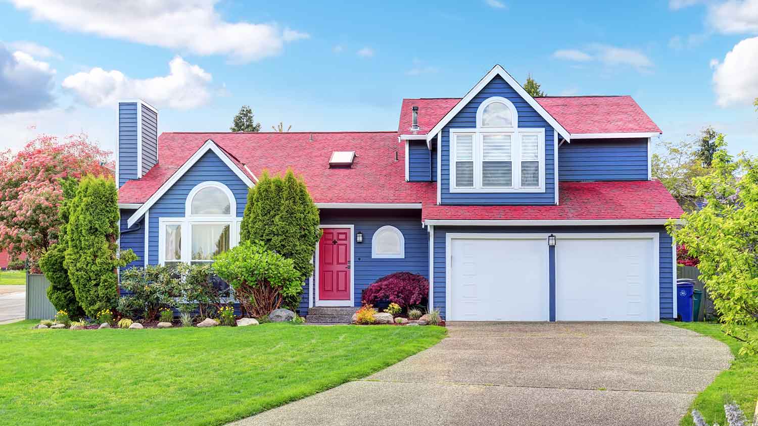 House with red roof and blue siding