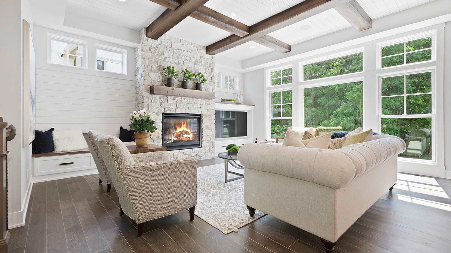 Family room with full windows, fireplace and hardwood floors