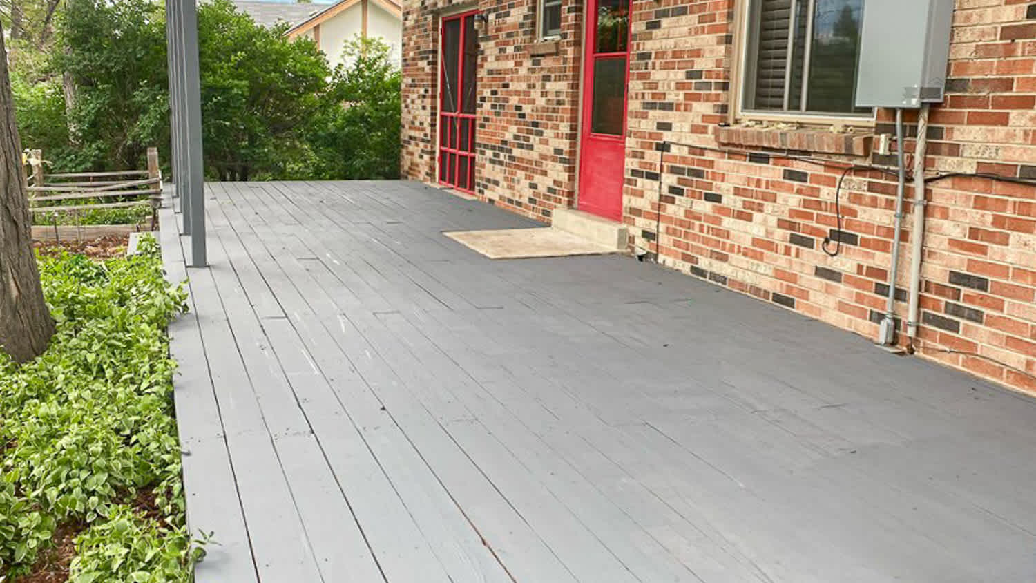 Brick house with gray deck