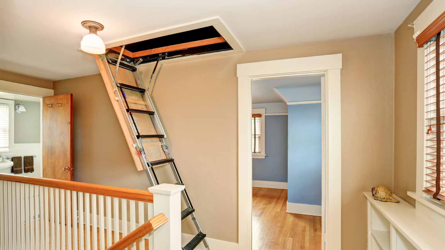 Attic ladder installed in the hallway of a home