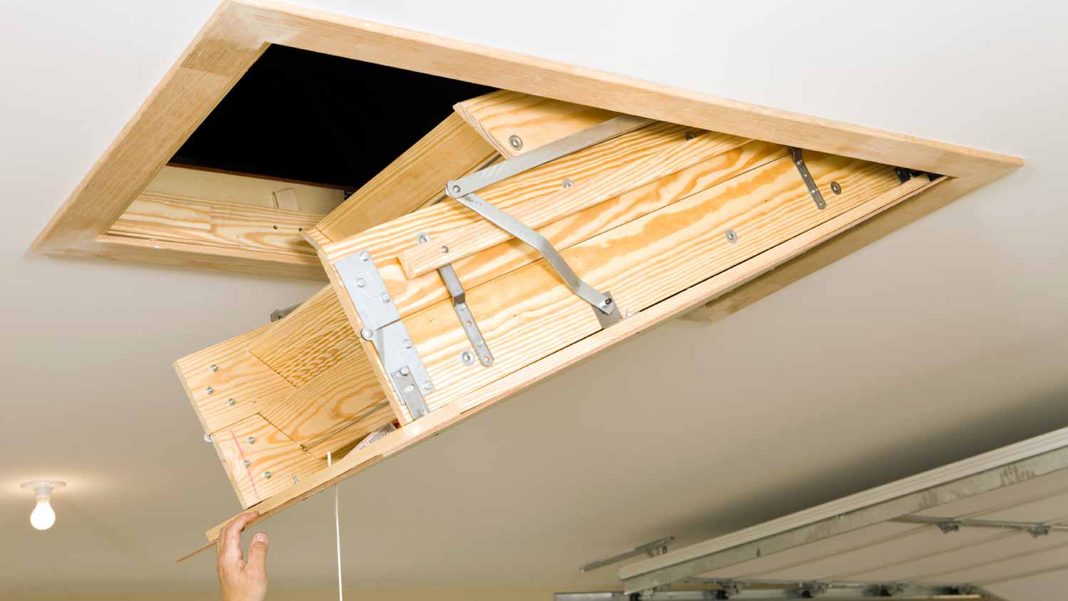 Folding attic access ladder