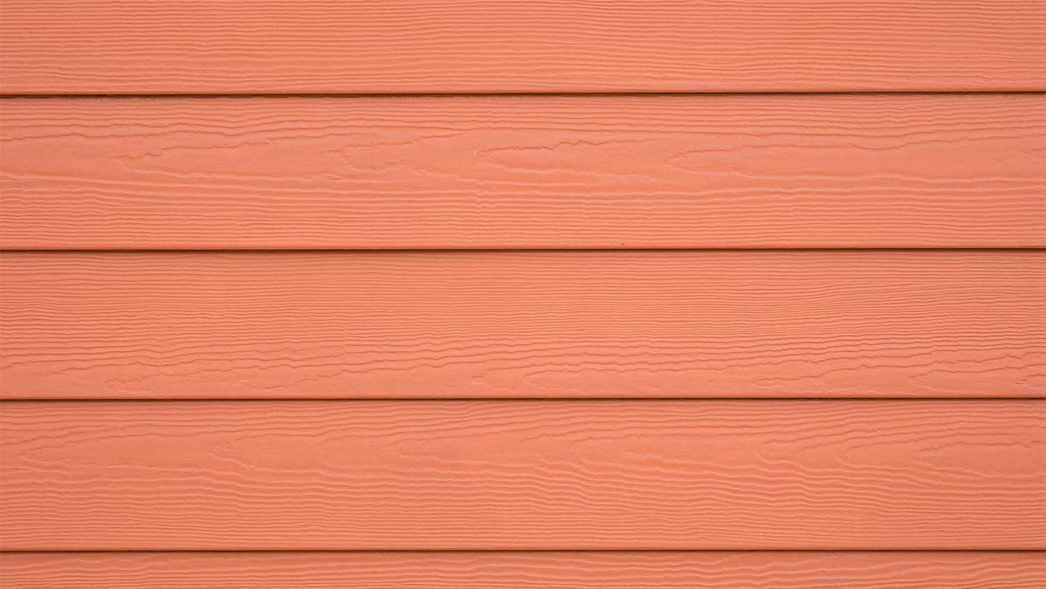 close up of red cement board siding