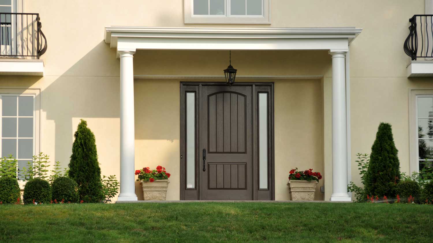 beige home with brown door