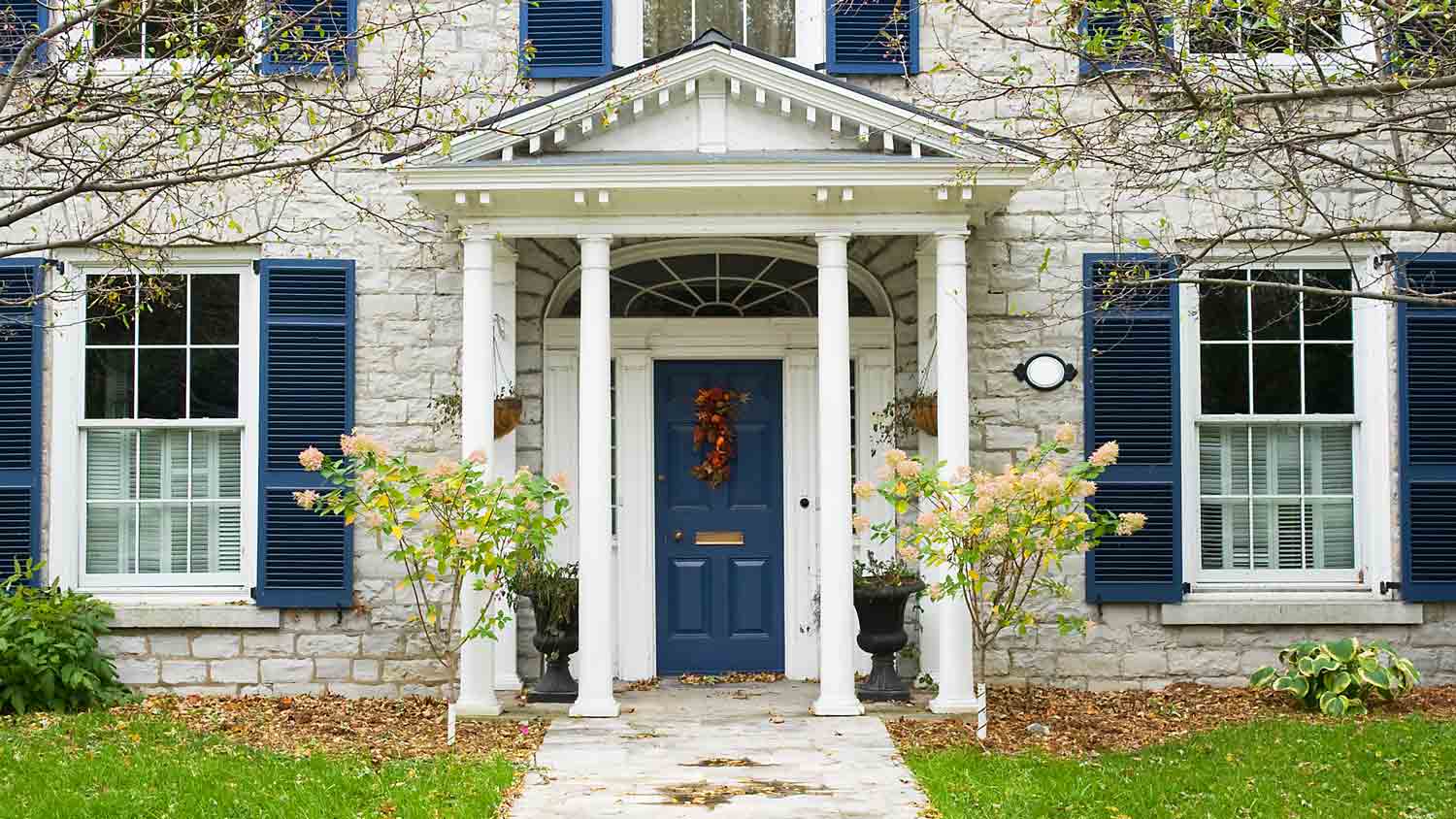 beige house navy door