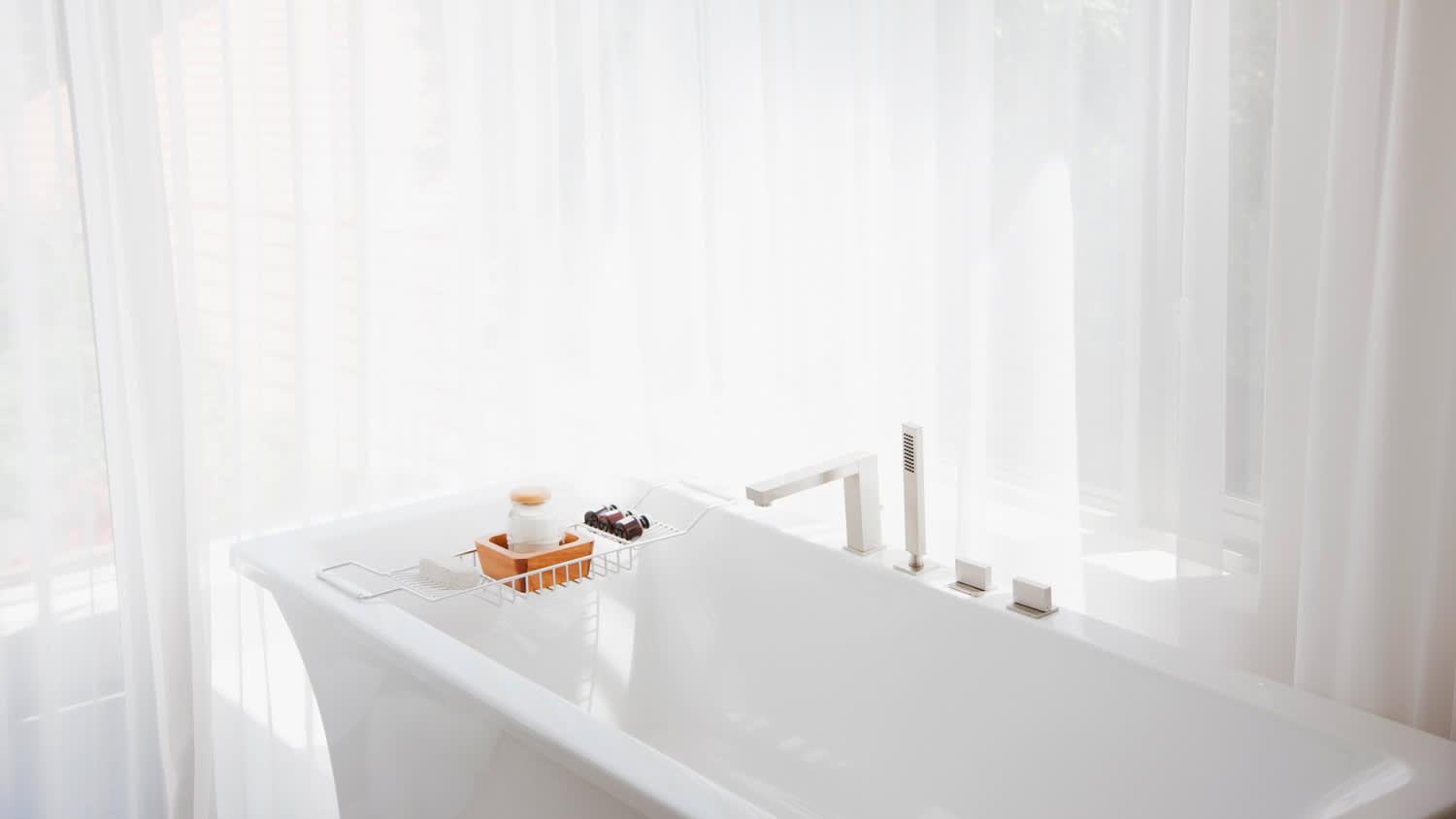 A modern bathtub in a bright bathroom