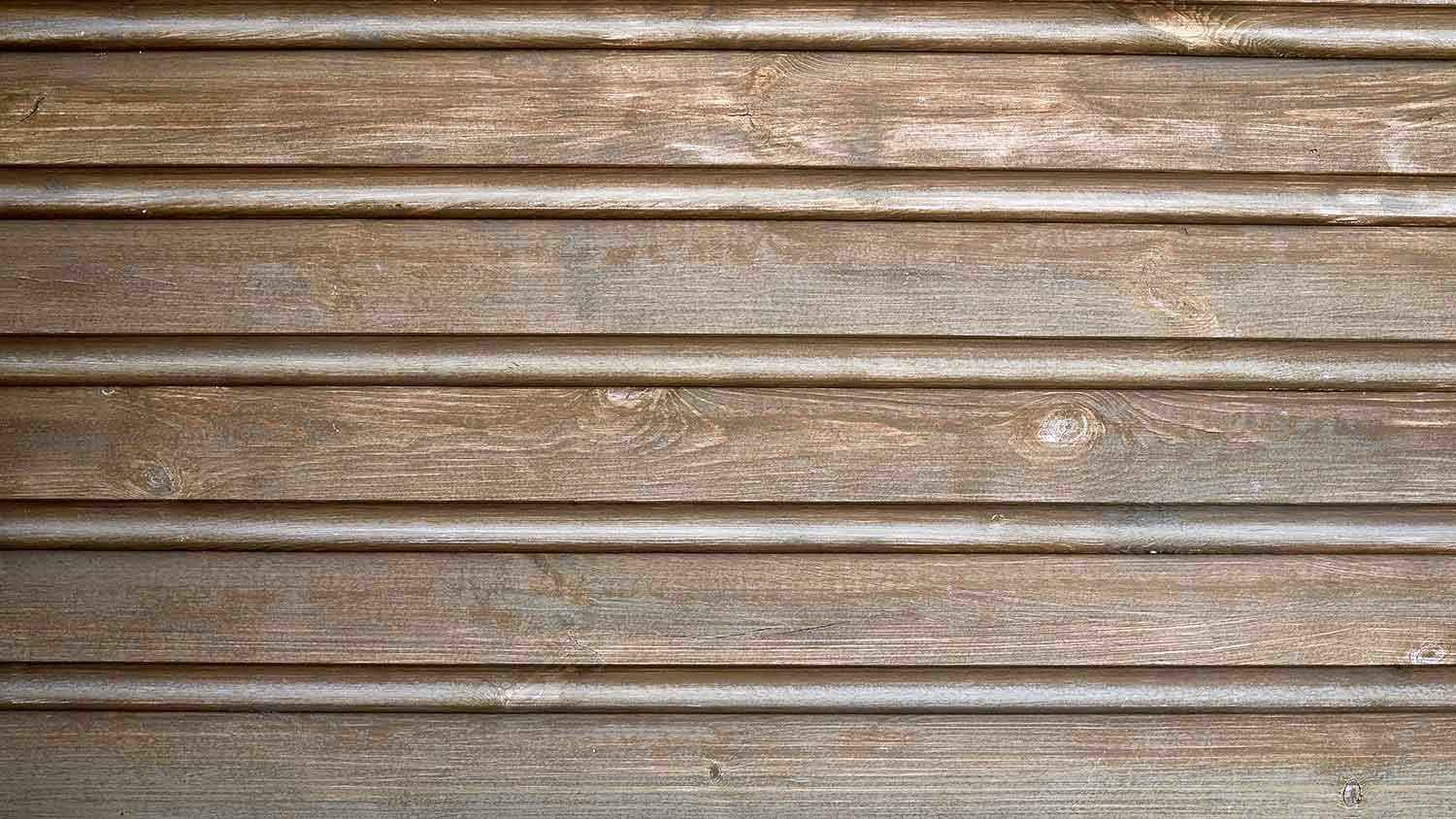 Closeup of a house with beaded seam siding
