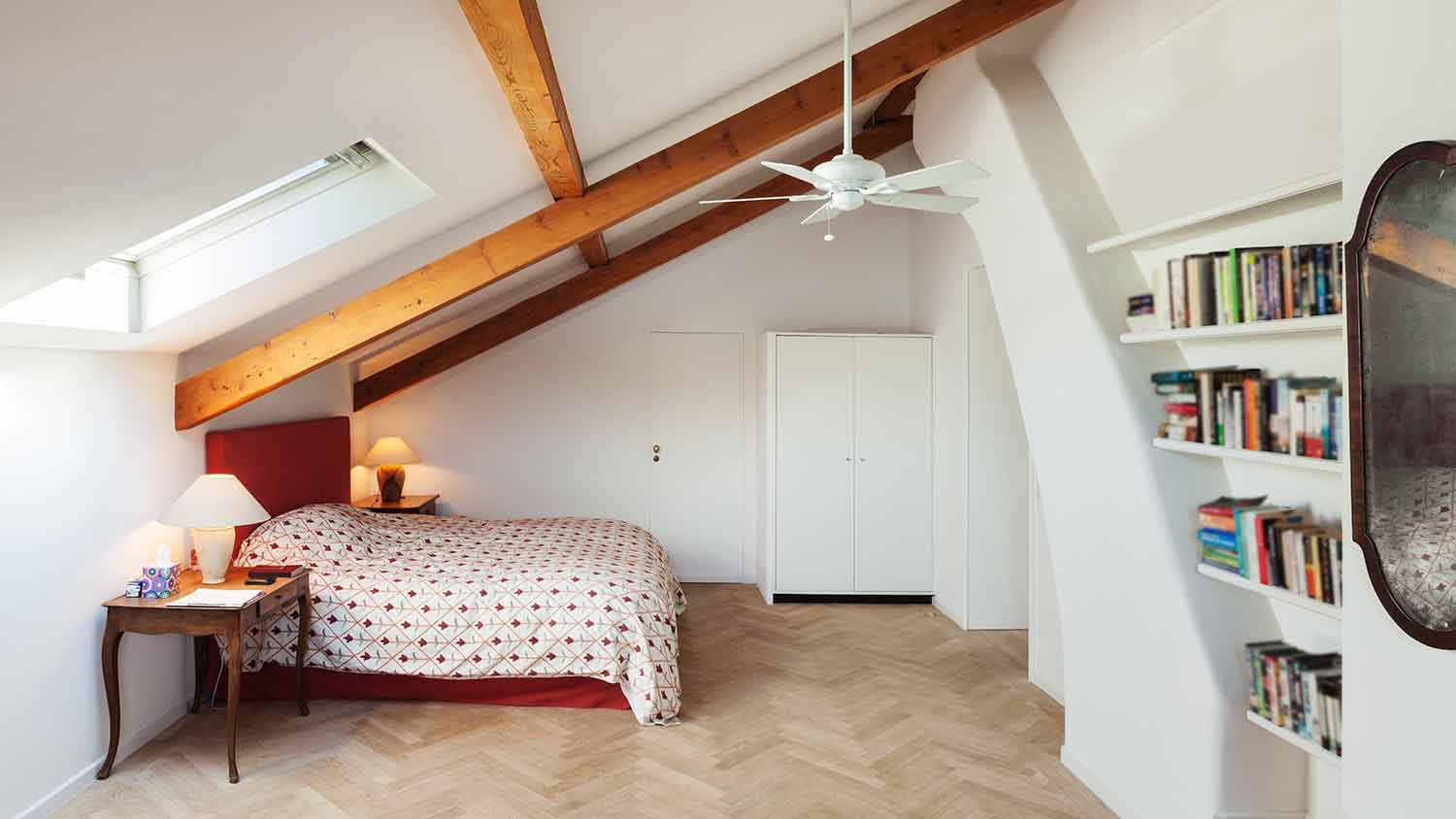 Attic bedroom with ceiling fan