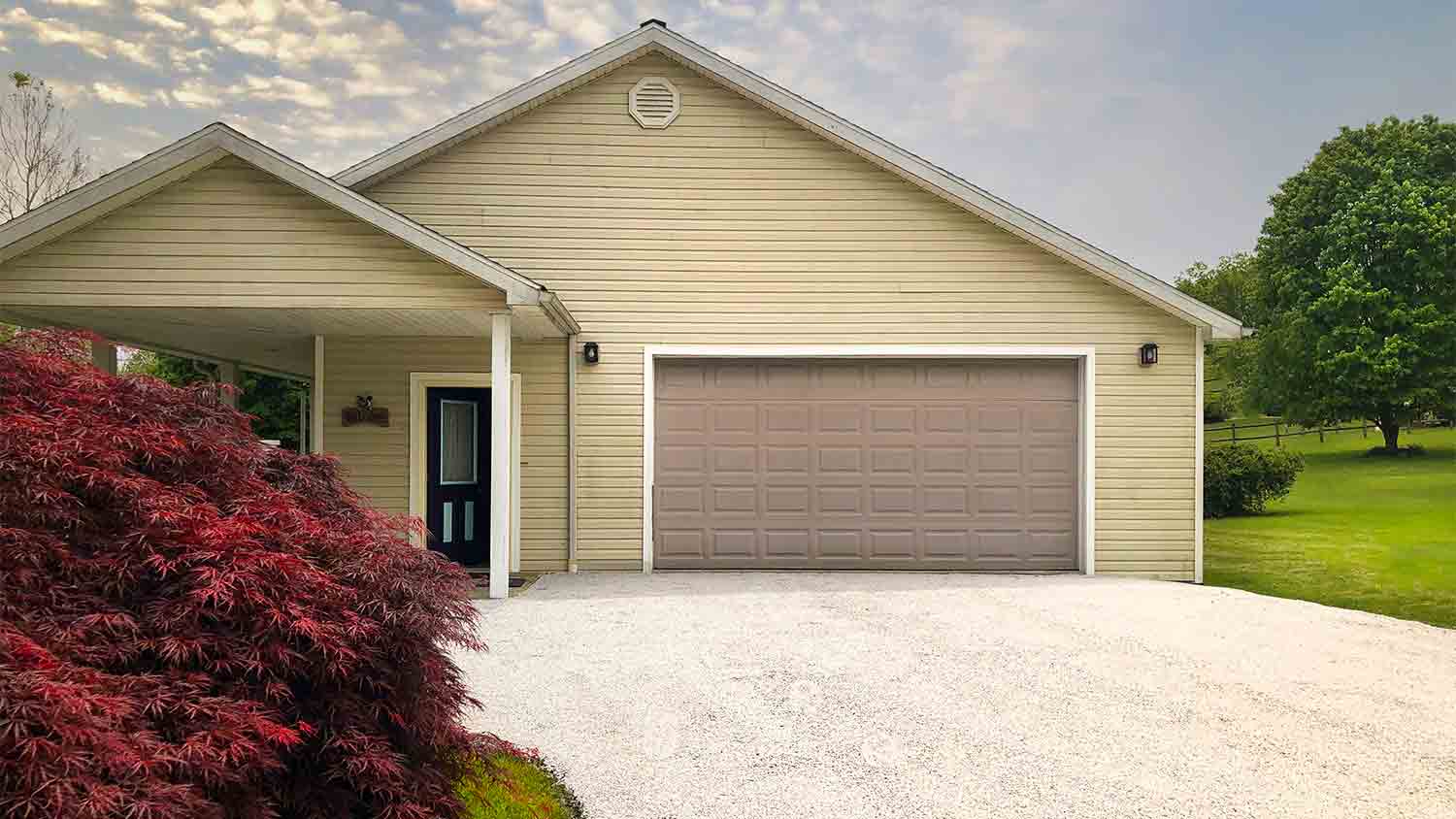 beige home with chip and seal driveway