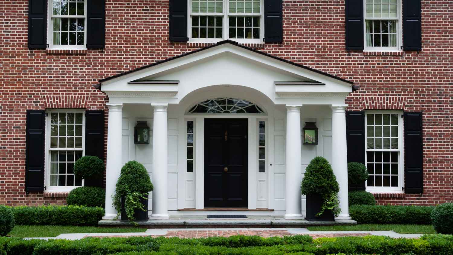 A large house with a black front door
