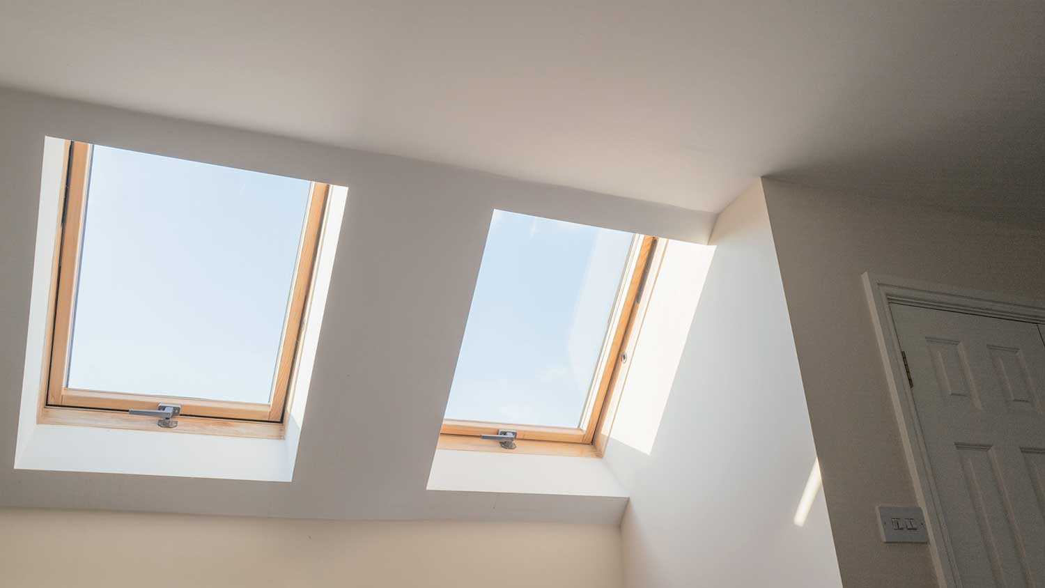 Two skylight windows installed in the attic