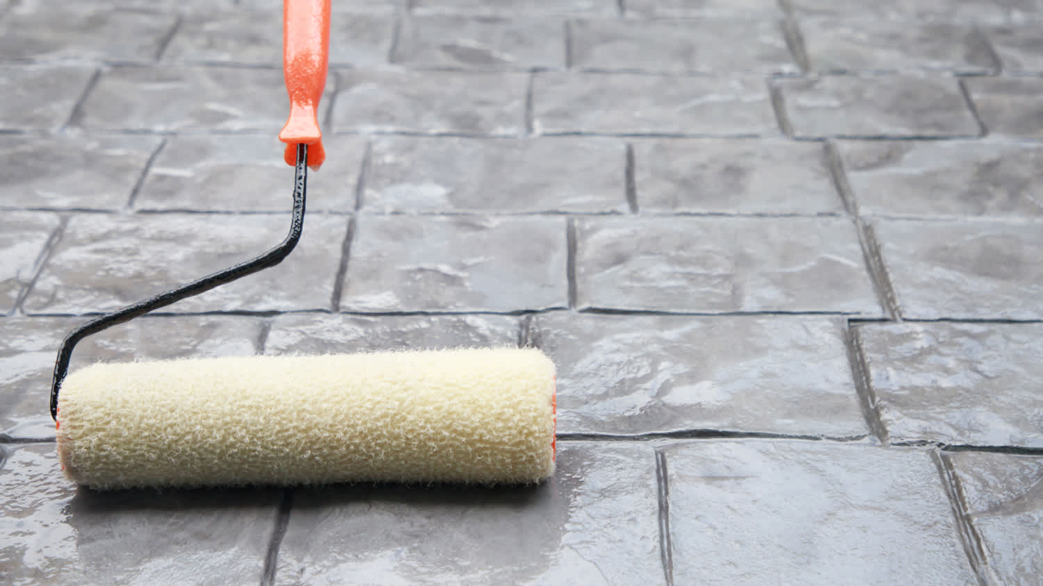 cleaning stamped concrete with roller