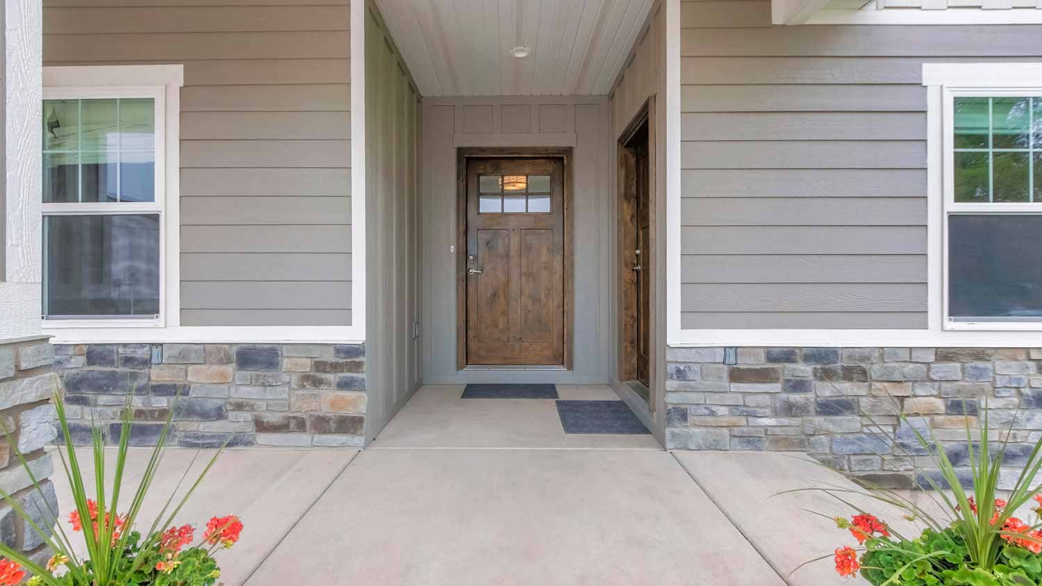 The exterior of a house with a stone veneer siding