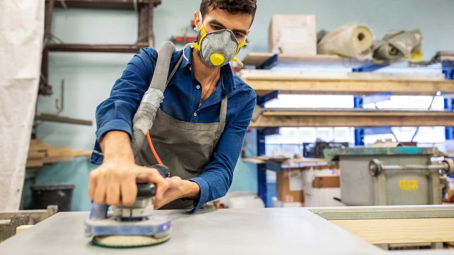 A person sanding a concrete surface