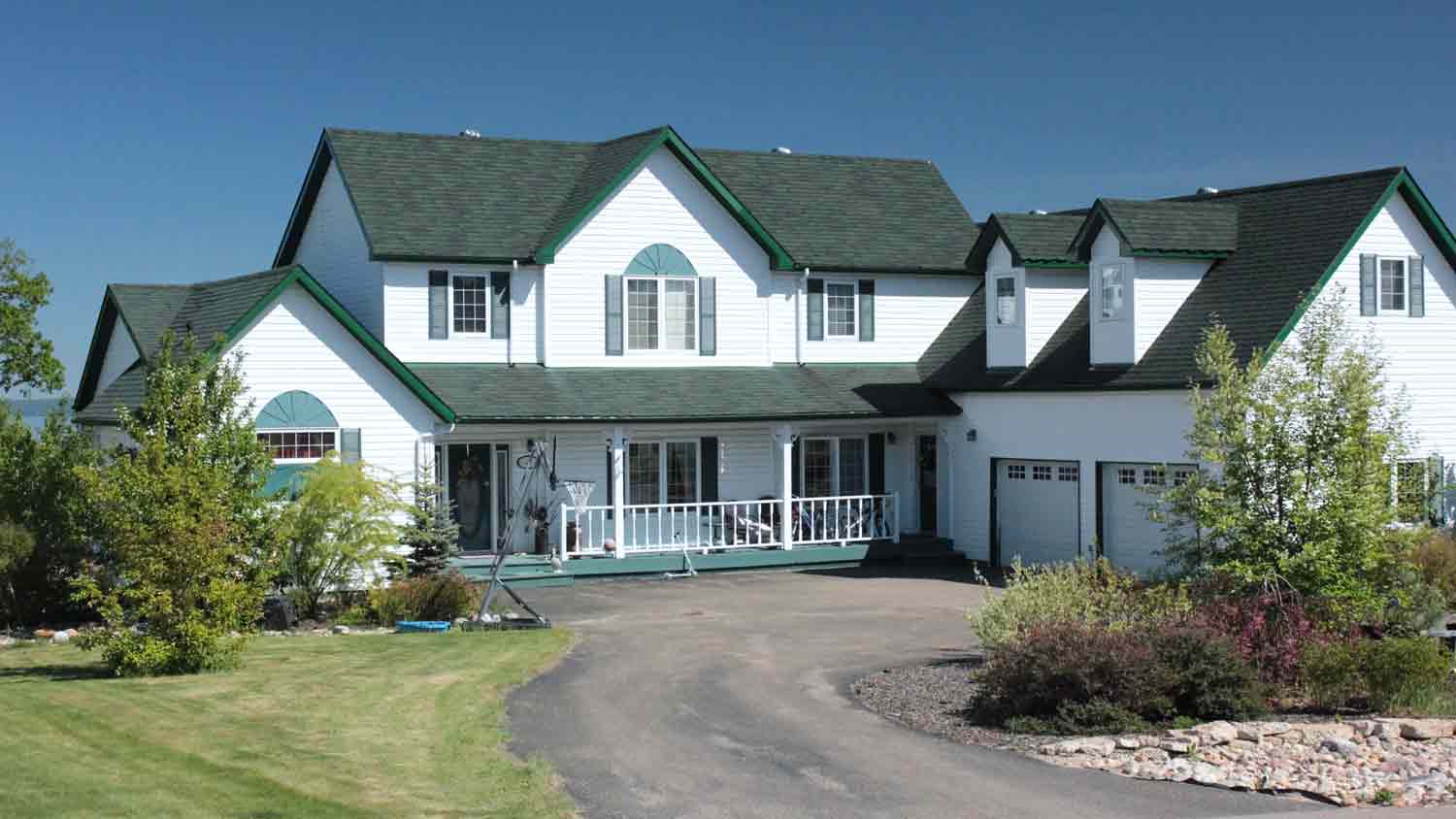 large white house with green roof
