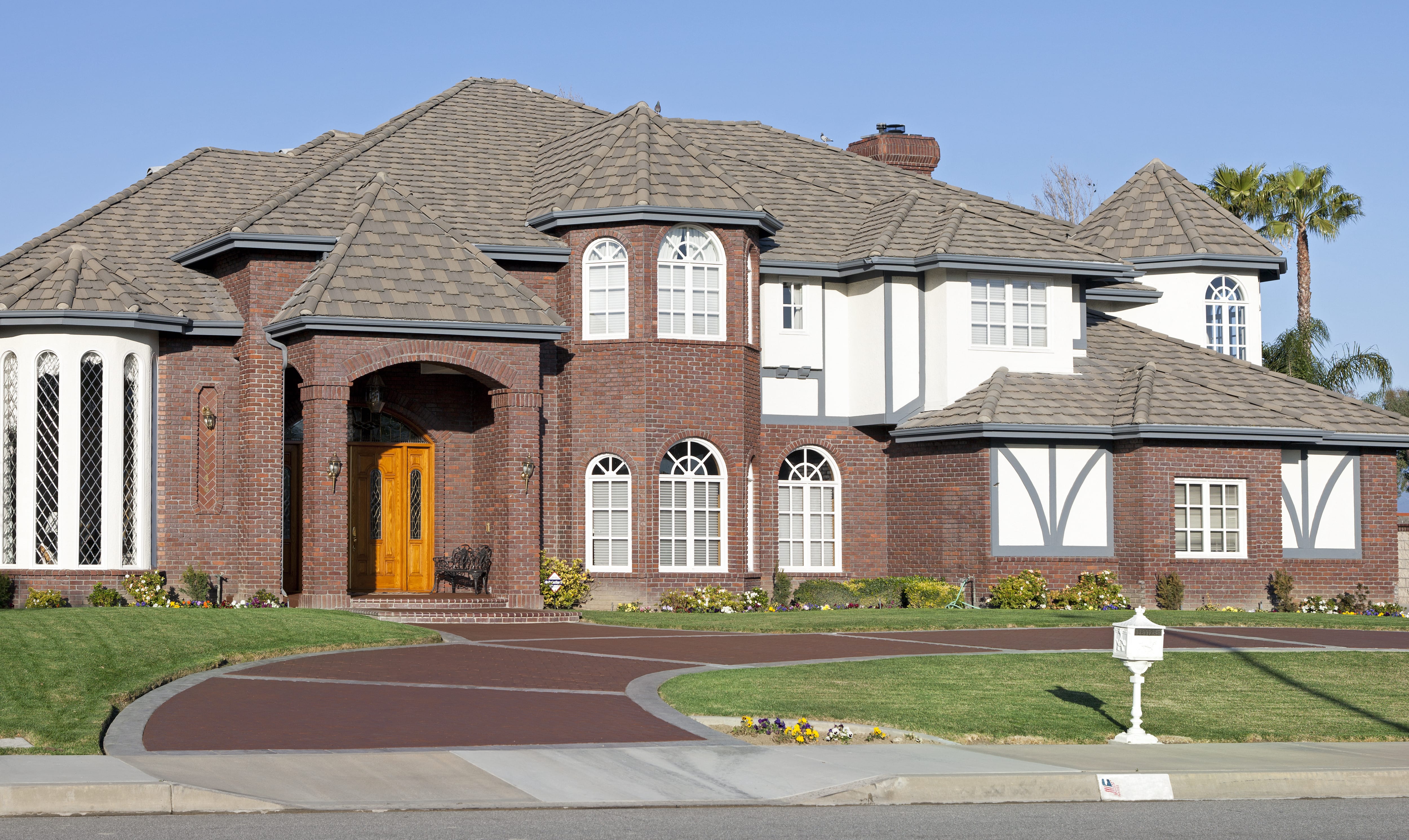 U-shaped driveway in front of large home