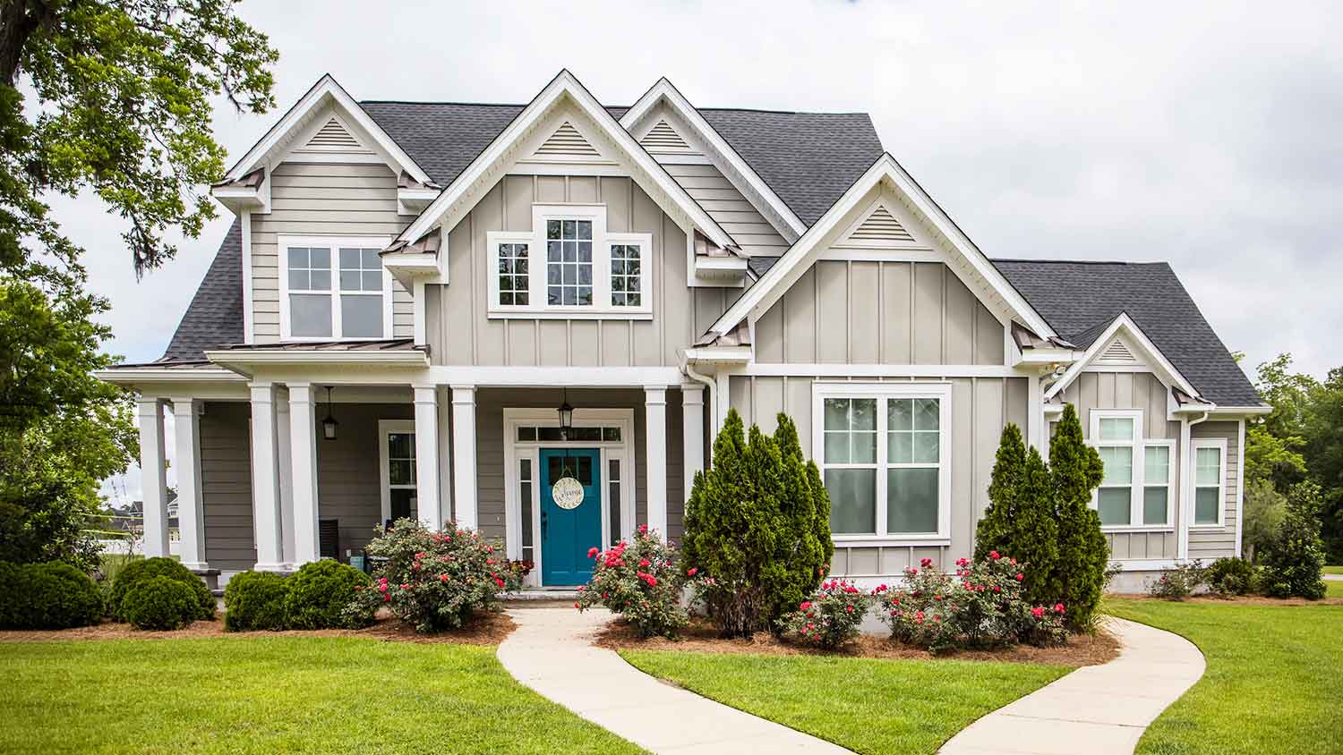 House with board and batten siding and pathway