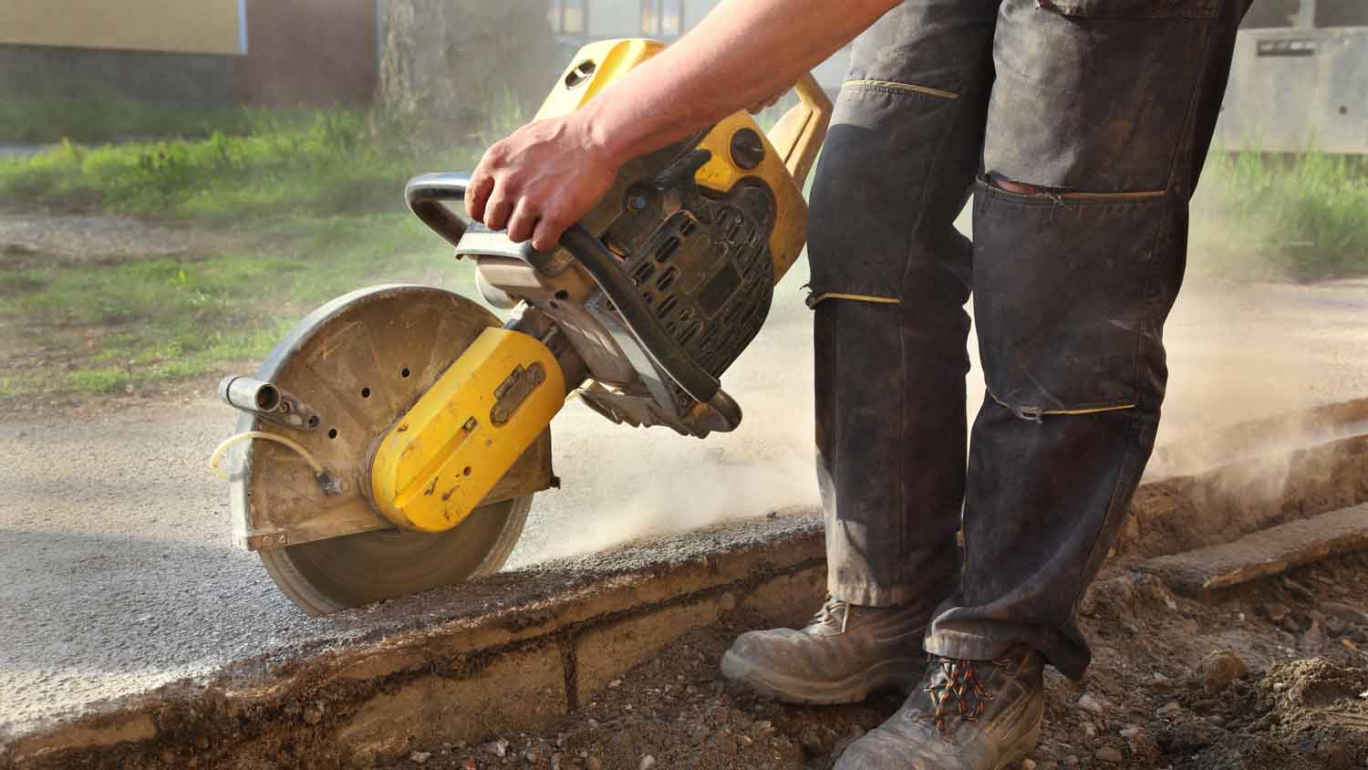 professional using concrete saw