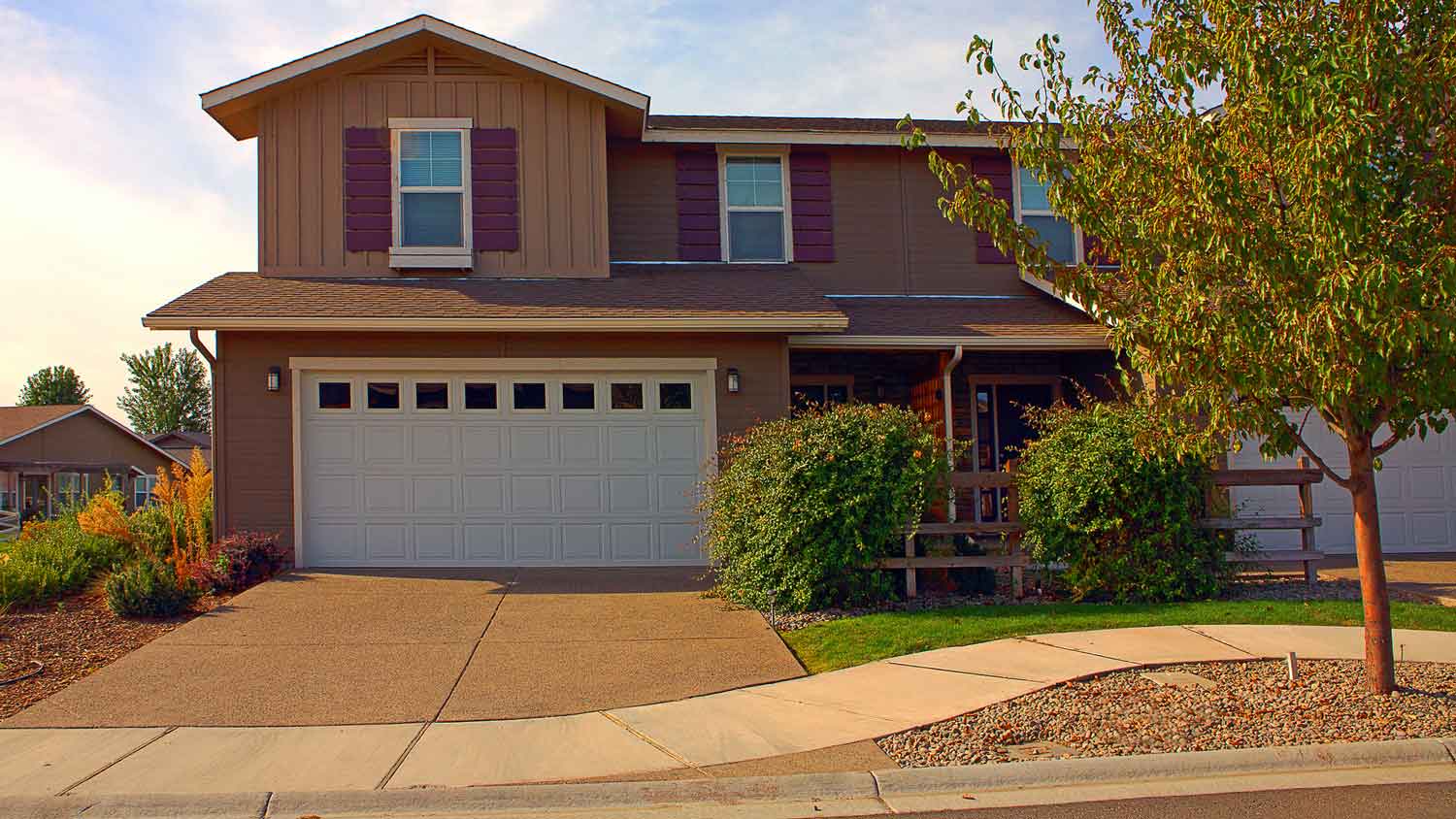 A house with a driveway apron in a suburban neighborhood