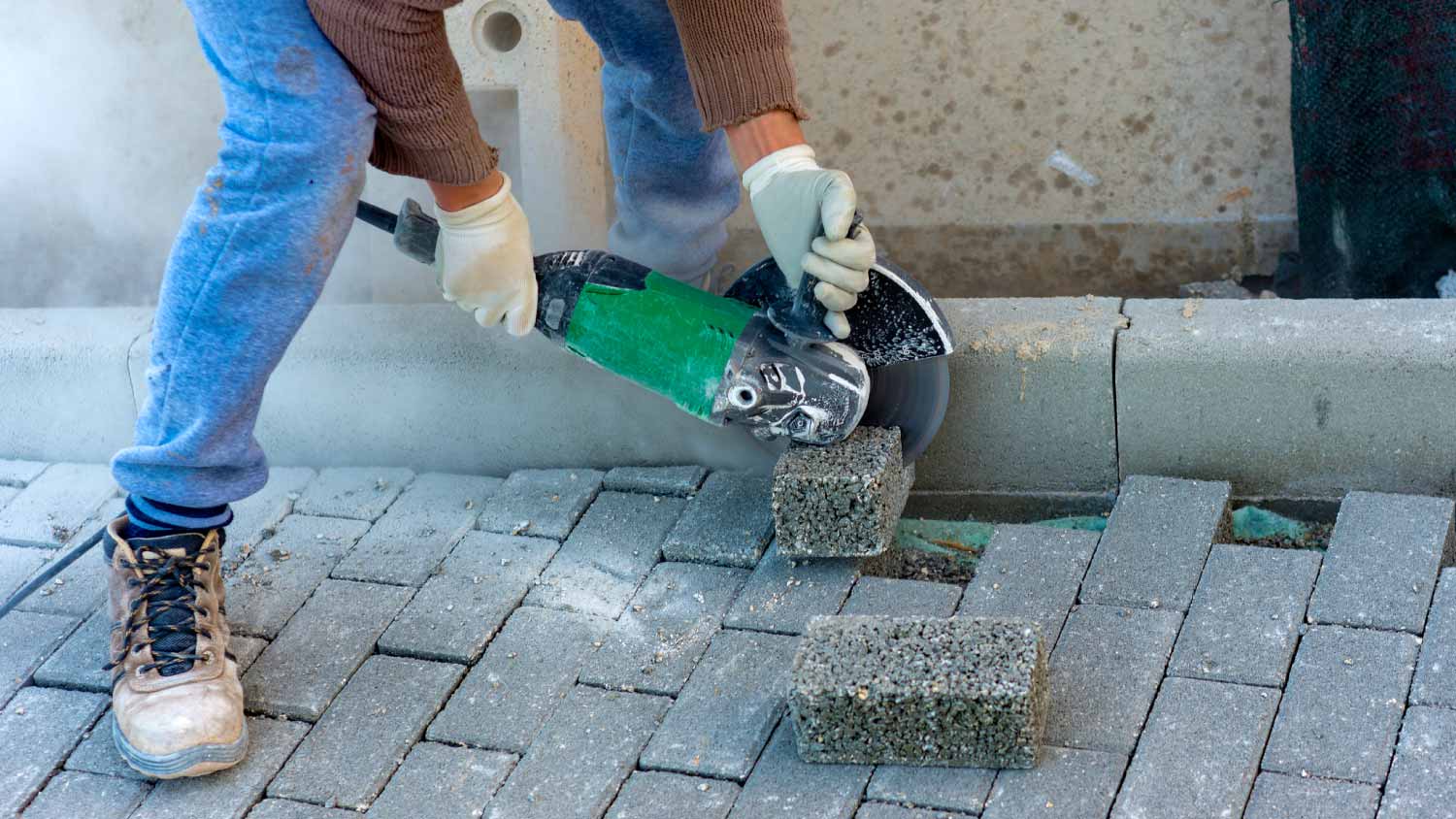 Worker cutting a brick