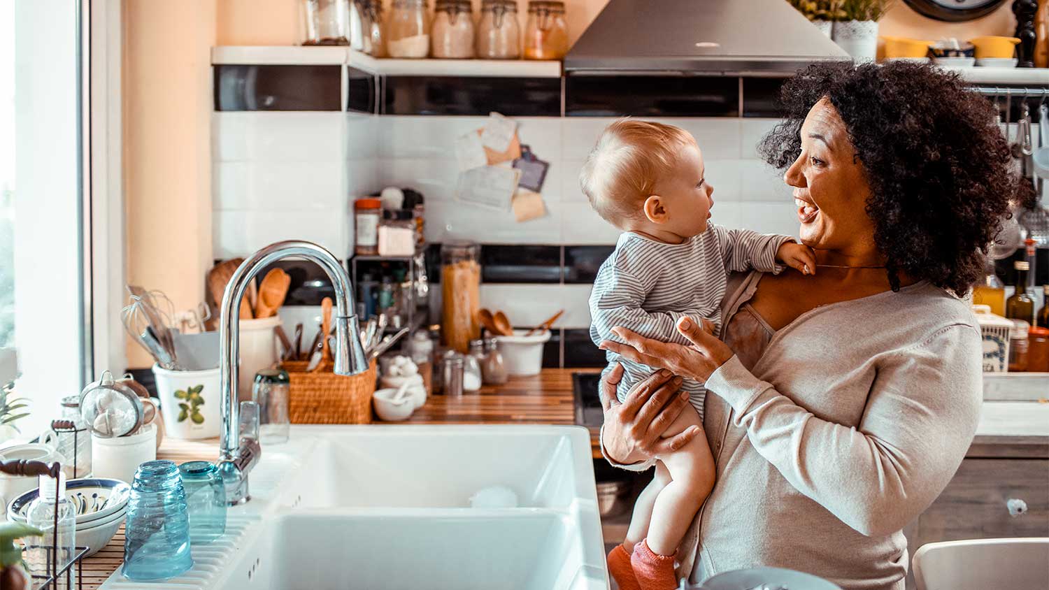 A grandmother and child in the kitchen