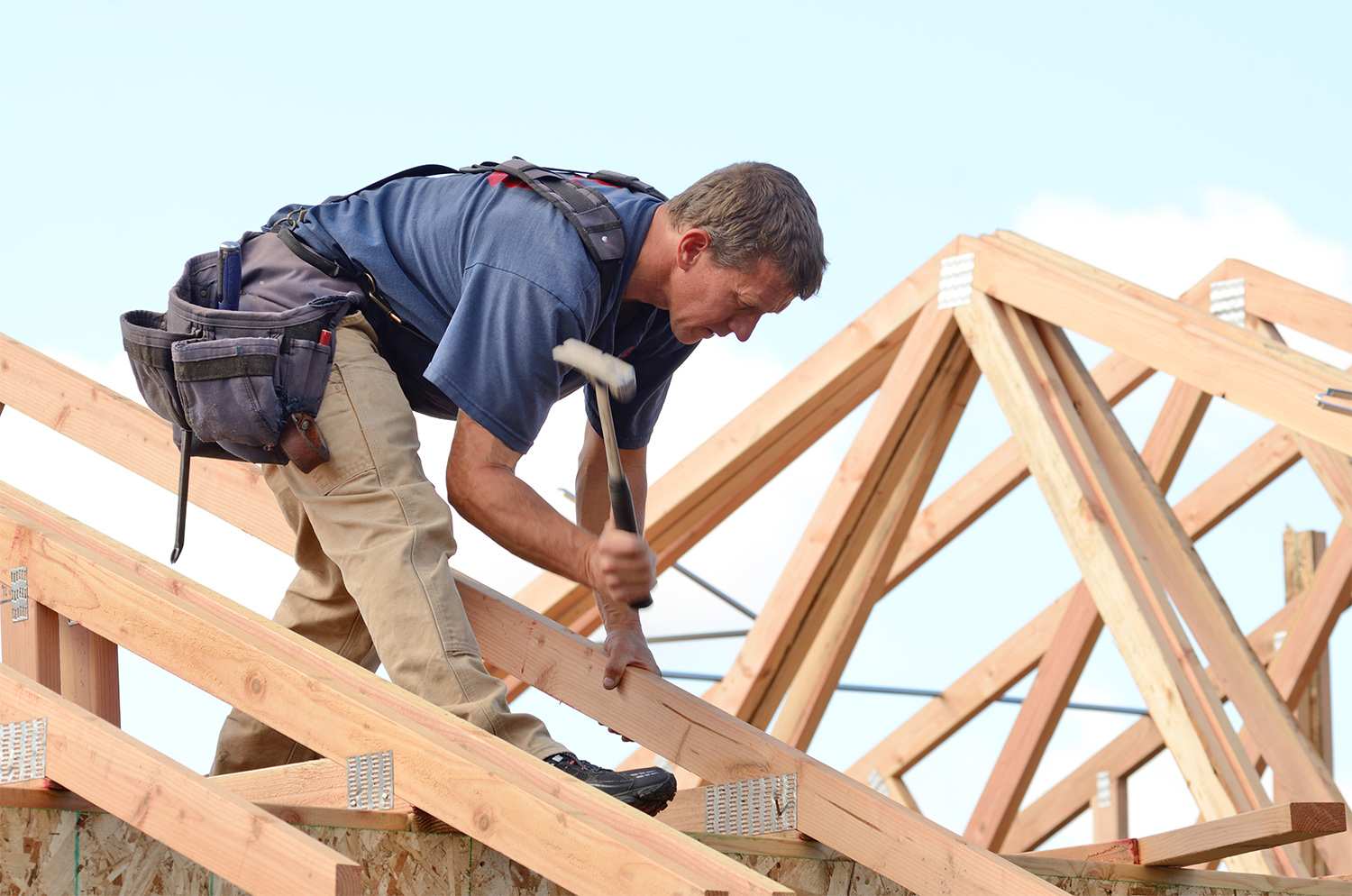 Construction working building roof with trusses