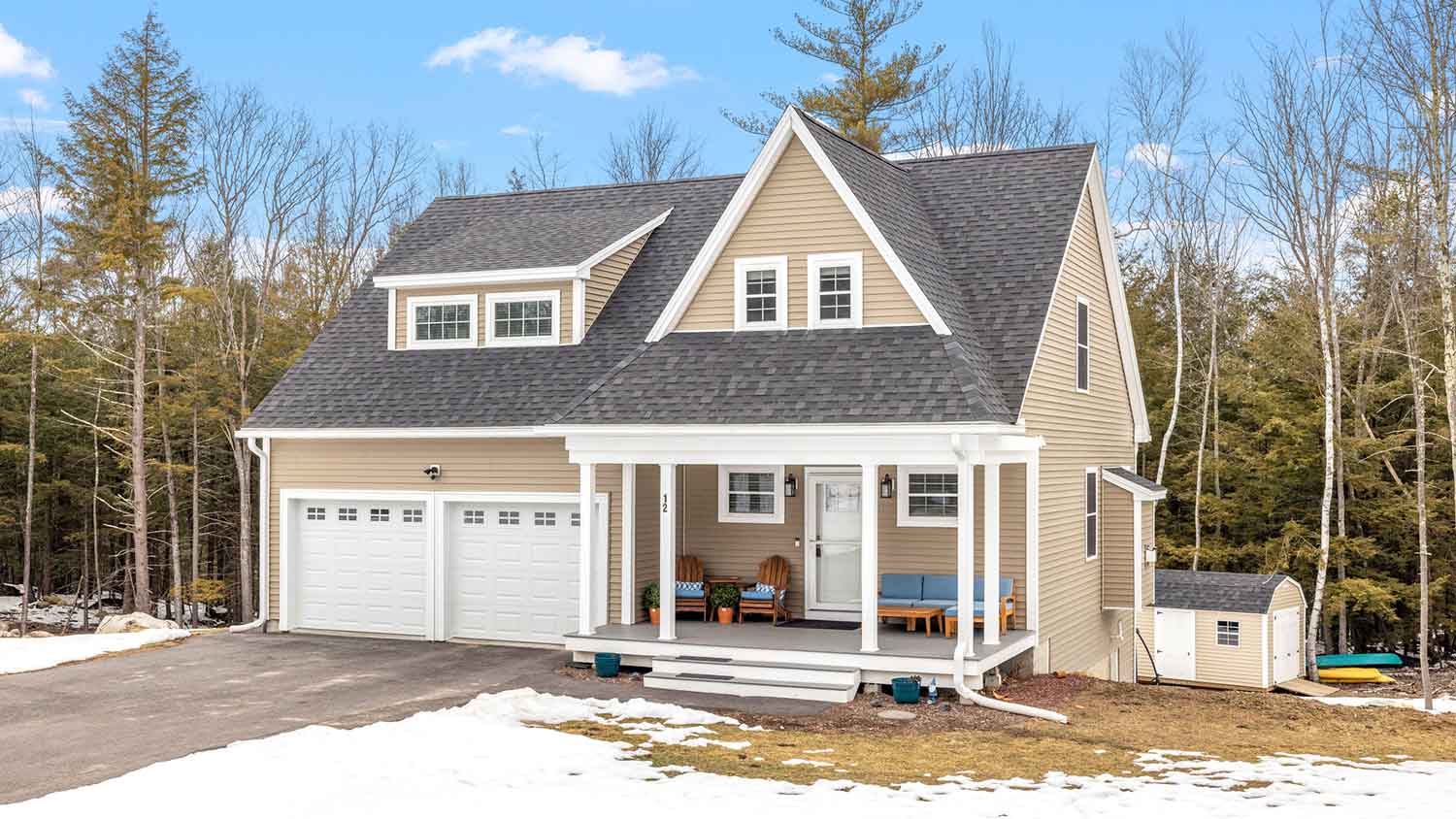 House in rural setting with snow on the ground