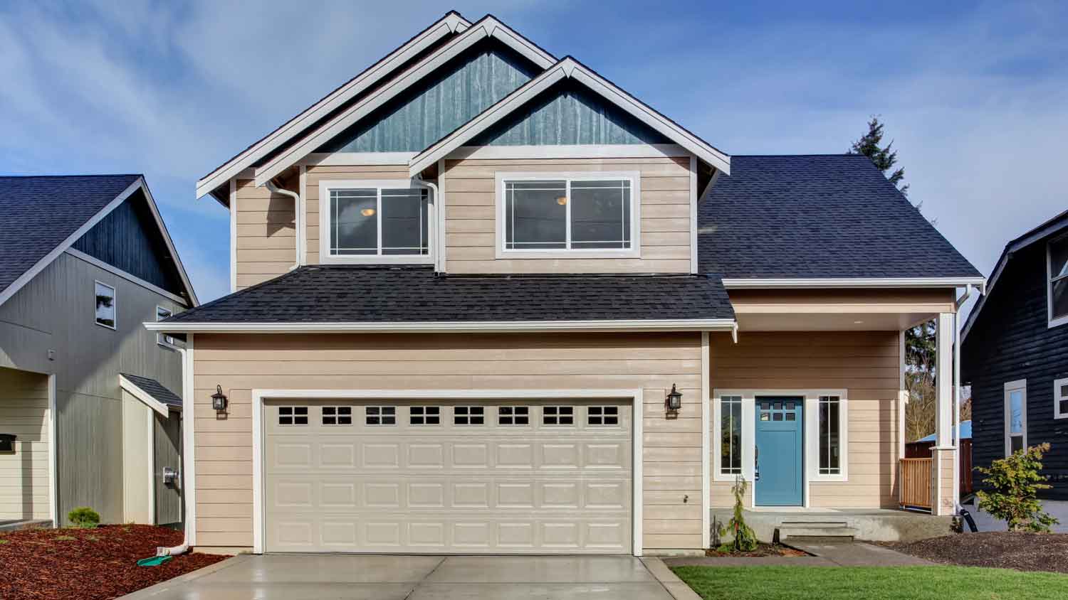 beige house exterior with garage