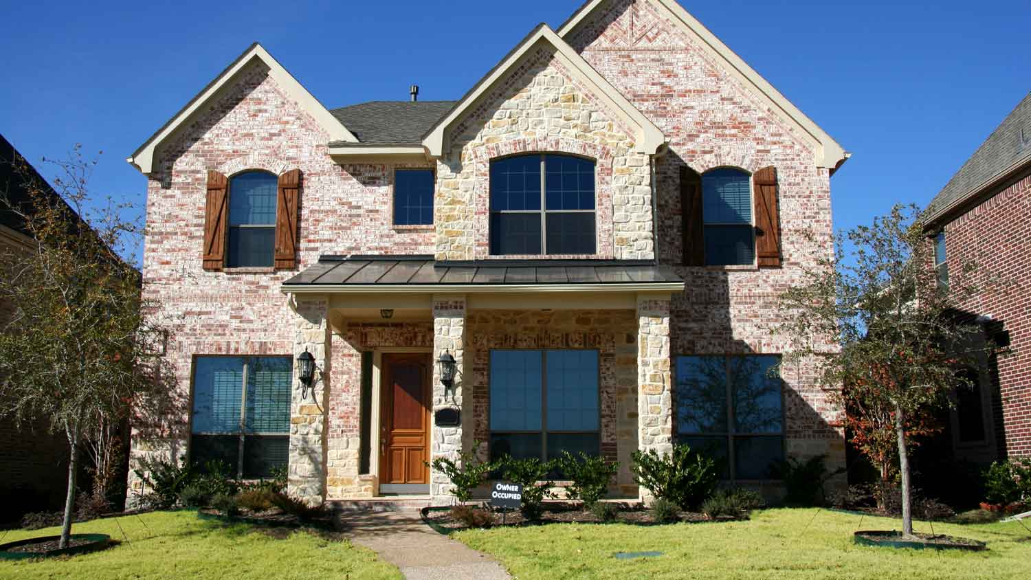 The exterior of an exposed brick house