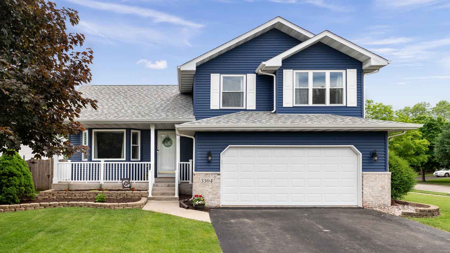 A suburban house with blue siding