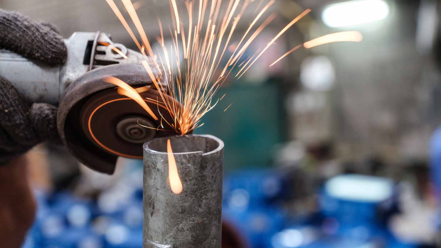 Man using electric angle grinder