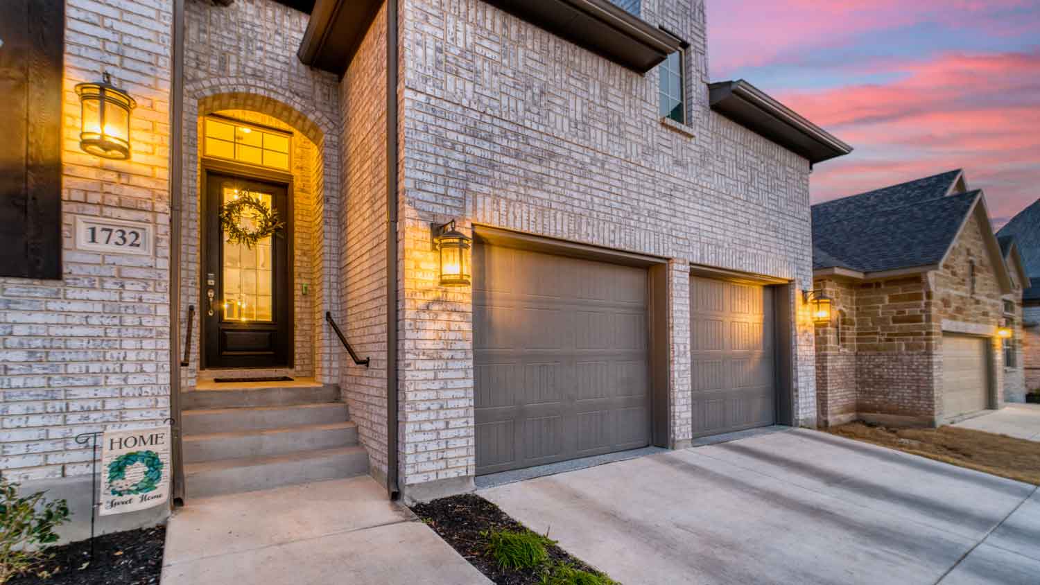 An exposed brick house at sunset