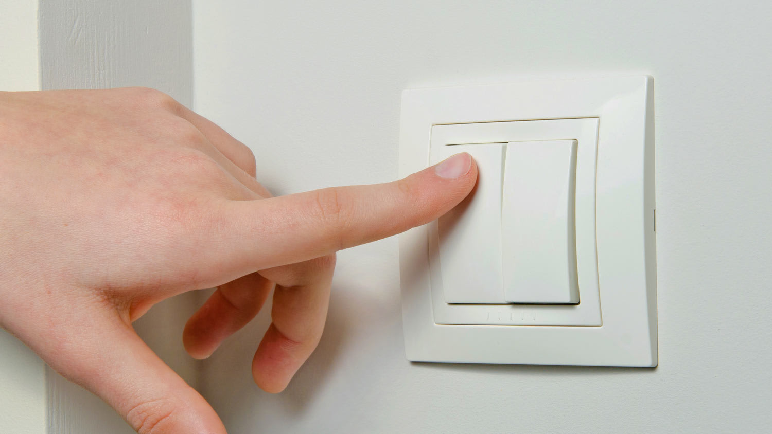 person switching light switch