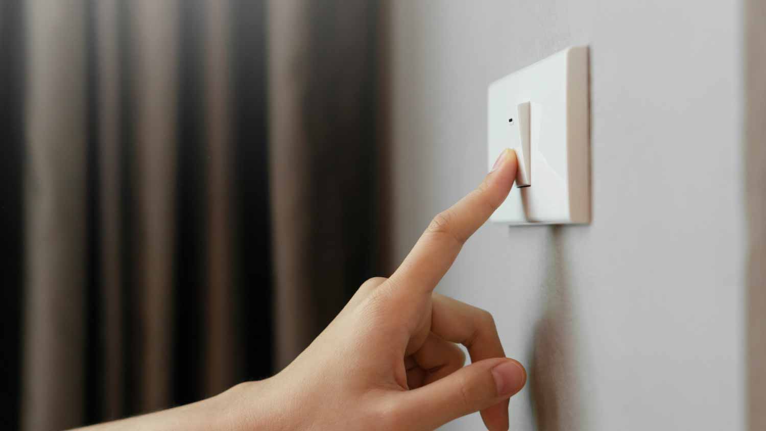 Woman turning lights off