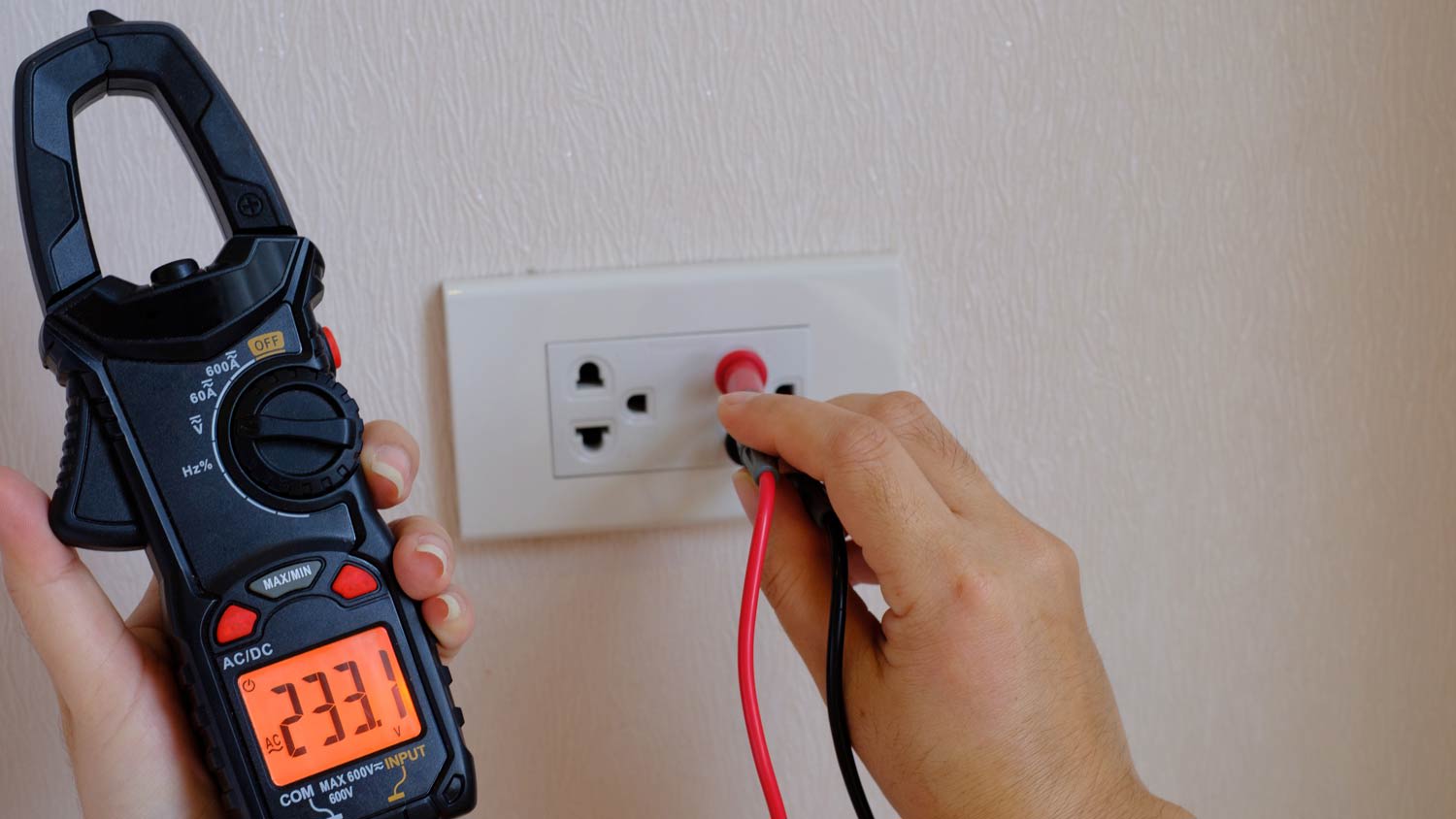 technician testing power outlet